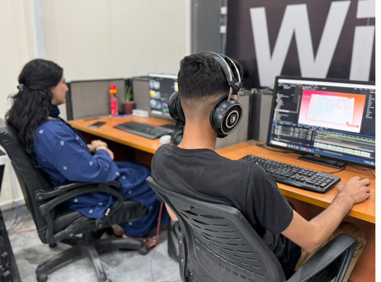 Editors working at a PC
